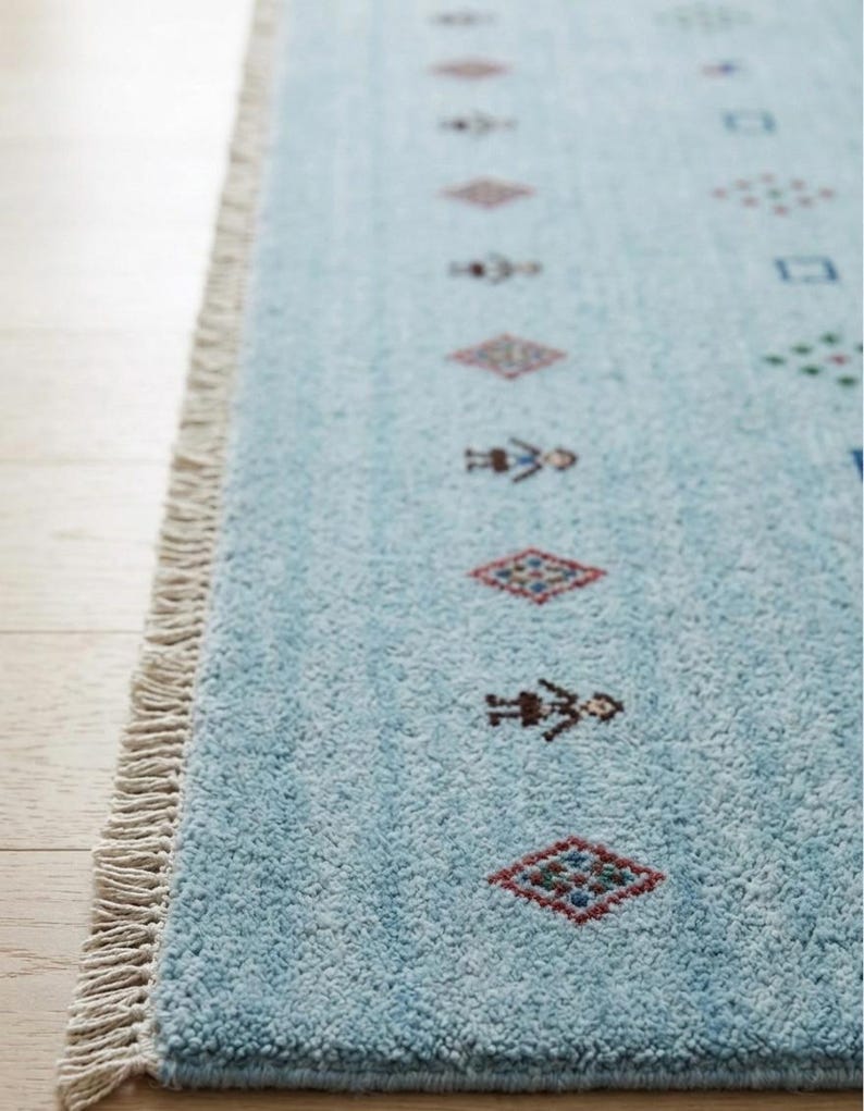Artisanal Hand-Knotted Pale Azure Rug with Folk Symbols