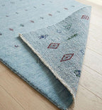 Artisanal Hand-Knotted Pale Azure Rug with Folk Symbols