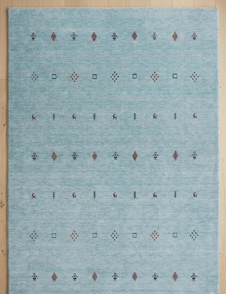 Artisanal Hand-Knotted Pale Azure Rug with Folk Symbols