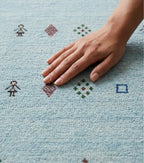 Artisanal Hand-Knotted Pale Azure Rug with Folk Symbols